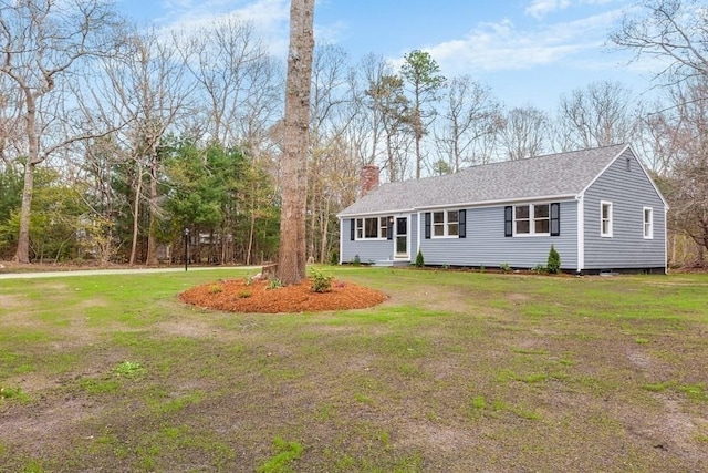 single story home with a shingled roof, a front yard, and a chimney