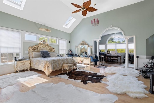 30 Bridle Path, Shrewsbury, MA 01545 - bedroom featuring ornate columns, high vaulted ceiling, wood finished floors, and a skylight
