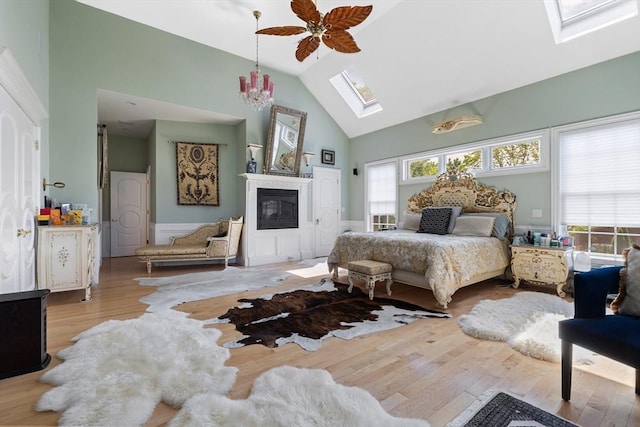 30 Bridle Path, Shrewsbury, MA 01545 - bedroom with wood finished floors, high vaulted ceiling, multiple windows, and a skylight