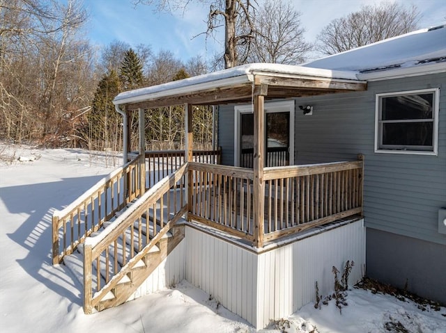 view of snow covered deck