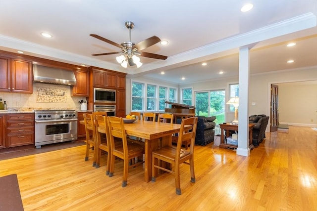dining room with crown molding, ceiling fan, light wood-type flooring, and recessed lighting