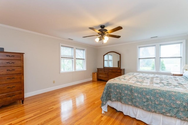 bedroom featuring multiple windows, light wood-style floors, baseboards, crown molding, and ceiling fan