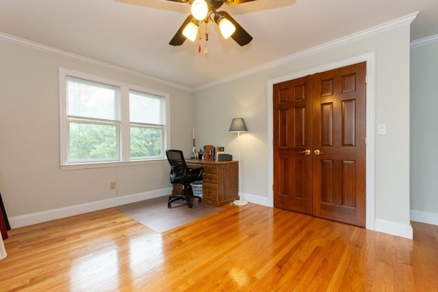 office area with ornamental molding, wood finished floors, baseboards, and a ceiling fan
