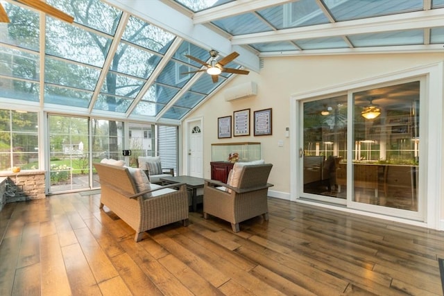 sunroom / solarium with ceiling fan, a skylight, and a wall mounted AC