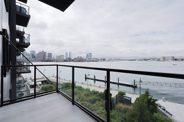 balcony featuring a water view