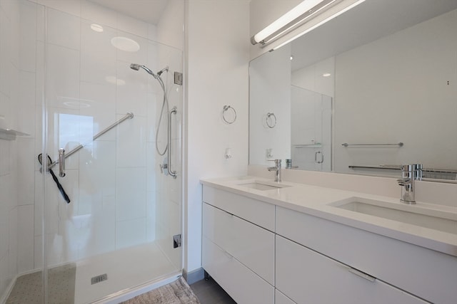 bathroom with vanity and a shower with door