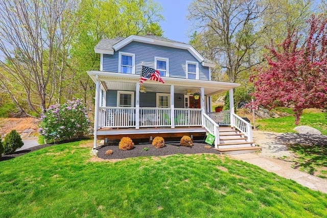 view of front of home with a porch and a front yard
