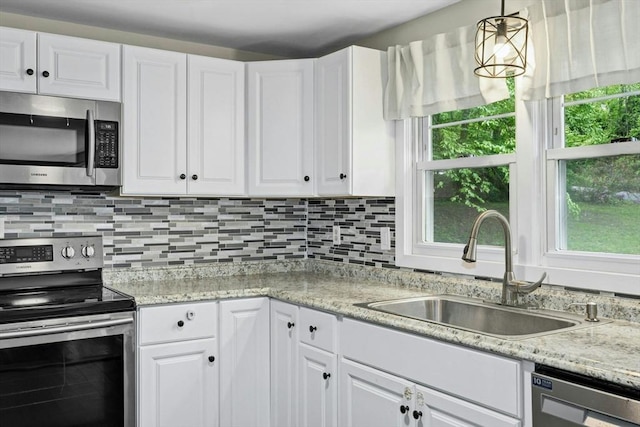 15 Dodge Hill Rd, Sutton, MA 01590 - kitchen with stainless steel appliances, a sink, white cabinetry, and tasteful backsplash