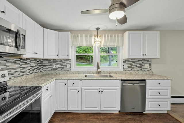 15 Dodge Hill Rd, Sutton, MA 01590 - kitchen with appliances with stainless steel finishes, a sink, a baseboard heating unit, ceiling fan, and tasteful backsplash