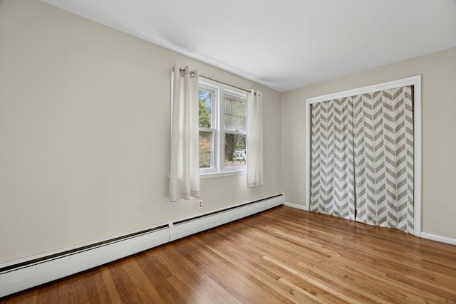 15 Dodge Hill Rd, Sutton, MA 01590 - empty room with baseboard heating, light wood-style floors, and baseboards