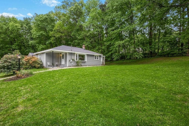 15 Dodge Hill Rd, Sutton, MA 01590 - rear view of property featuring a yard, a chimney, and a porch