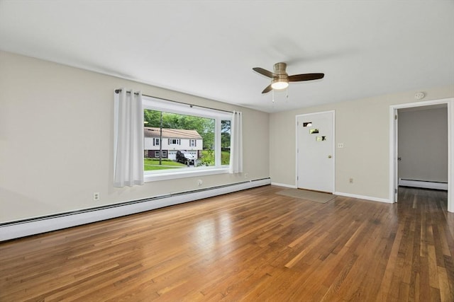 15 Dodge Hill Rd, Sutton, MA 01590 - unfurnished room with a baseboard heating unit, ceiling fan, wood finished floors, and baseboards