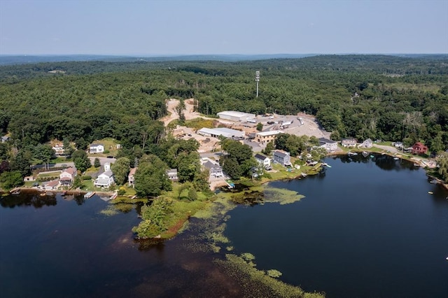 aerial view with a water view and a forest view