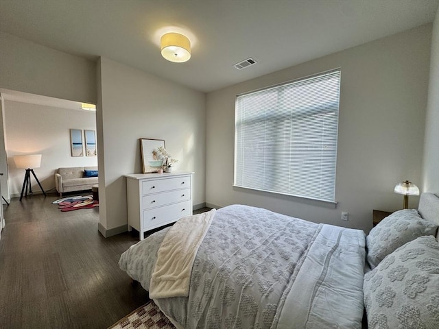 99 Tremont Unit 205, Boston, MA 02135 - bedroom featuring dark wood-style flooring and baseboards