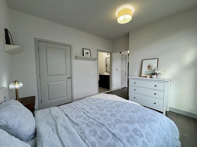 99 Tremont Unit 205, Boston, MA 02135 - bedroom with baseboards and connected bathroom