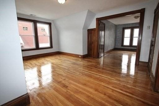 bonus room with wood-type flooring