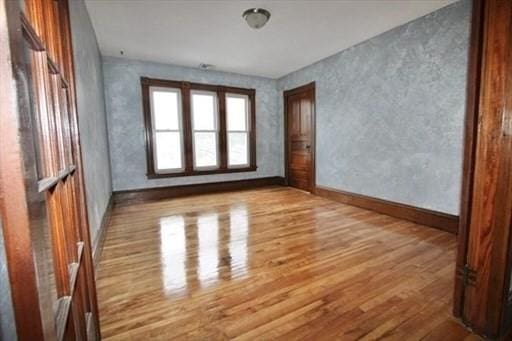 unfurnished room featuring light wood-type flooring