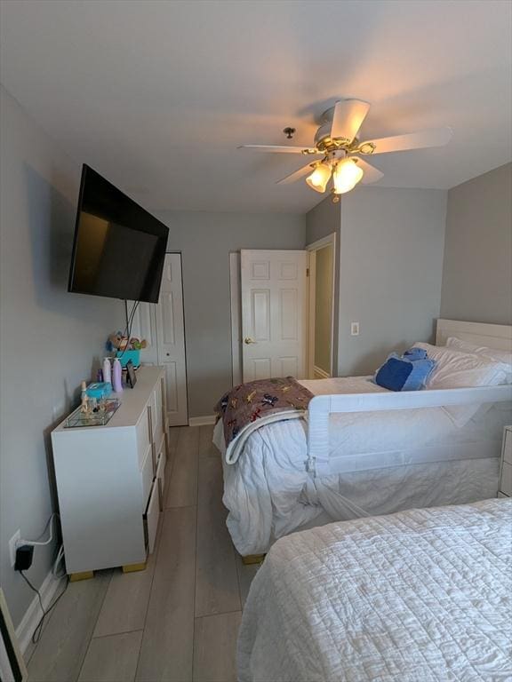 474 Revere Beach Blvd Unit 205, Revere, MA 02151 - bedroom with ceiling fan, light wood finished floors, and baseboards