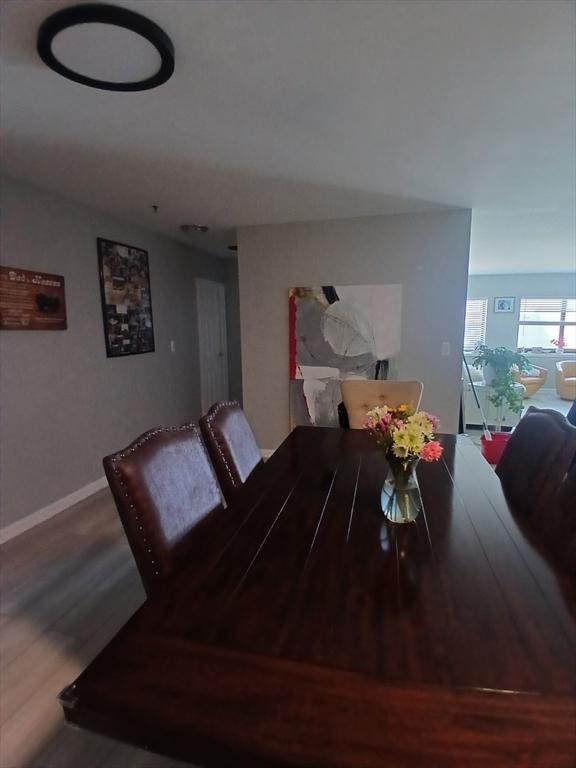 474 Revere Beach Blvd Unit 205, Revere, MA 02151 - dining room featuring wood finished floors and baseboards