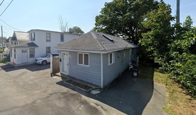8 Bridge St, Revere, MA 02151 - exterior space with roof with shingles