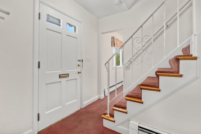 carpeted foyer entrance with a baseboard radiator