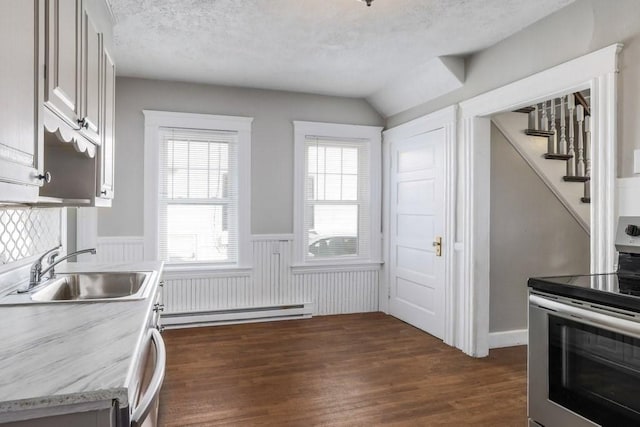 24 Tampa St, Worcester, MA 01604 - kitchen featuring electric stove, baseboard heating, wainscoting, light countertops, and dark wood-style floors