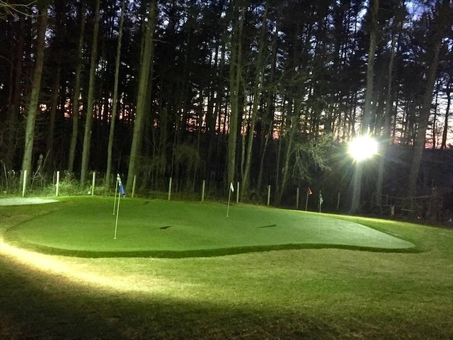 surrounding community with view of golf course