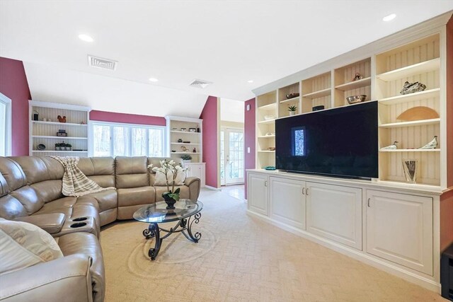 living room featuring recessed lighting, visible vents, and light carpet