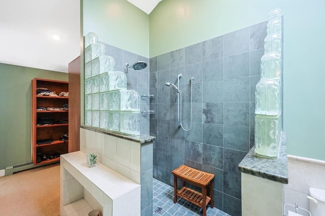 bathroom with walk in shower and tile walls