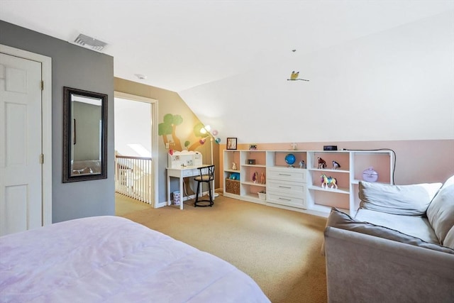 bedroom with vaulted ceiling, visible vents, and carpet
