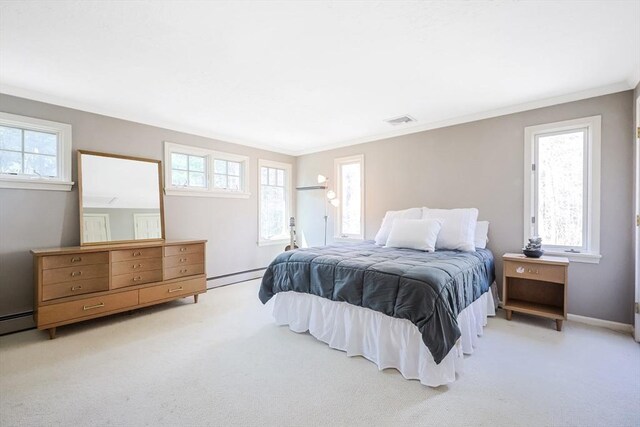 bedroom featuring light carpet, visible vents, a baseboard radiator, and multiple windows