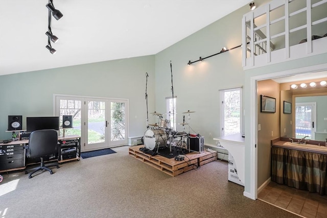 carpeted office featuring french doors, a sink, high vaulted ceiling, and rail lighting