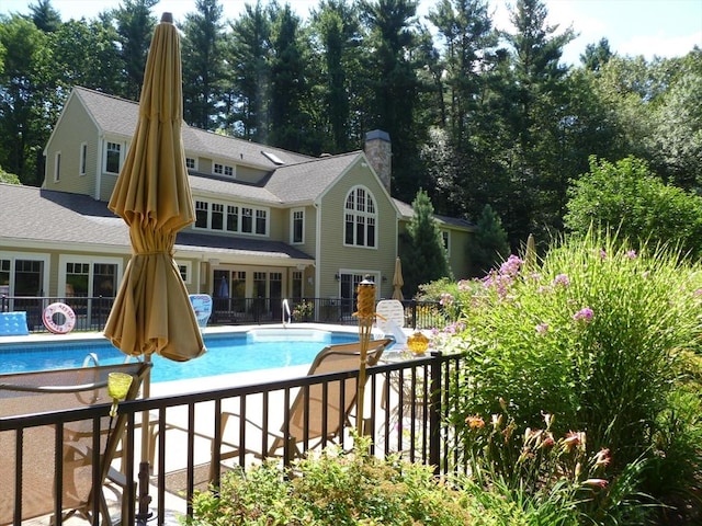 view of pool featuring a fenced in pool, a patio area, and fence