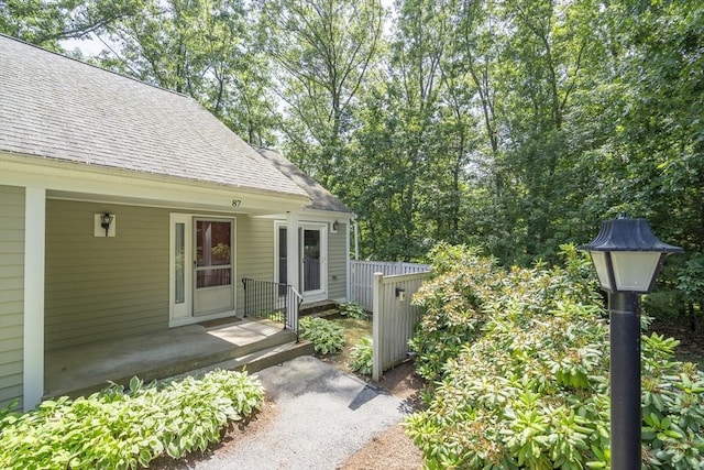 87 Fifer Ln Unit 87, Lexington, MA 02421 - doorway to property with roof with shingles