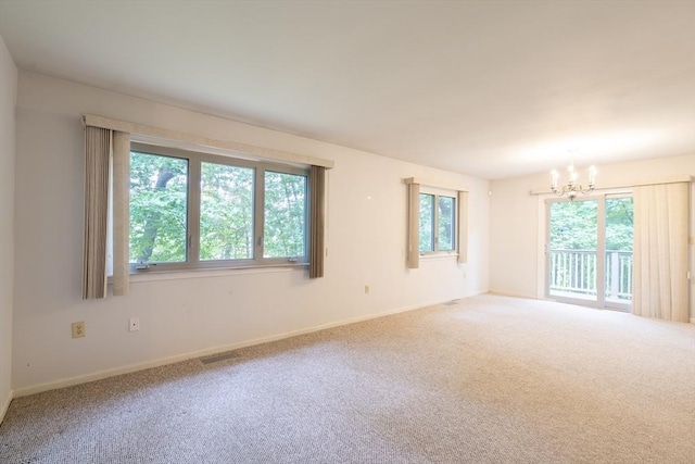 87 Fifer Ln Unit 87, Lexington, MA 02421 - carpeted empty room featuring a chandelier and baseboards
