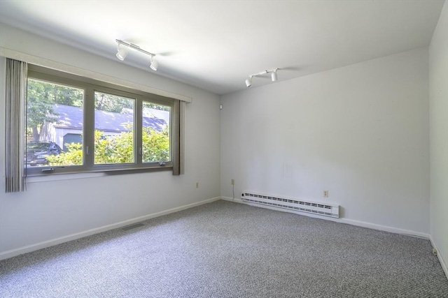 87 Fifer Ln Unit 87, Lexington, MA 02421 - empty room featuring a baseboard heating unit, rail lighting, and carpet