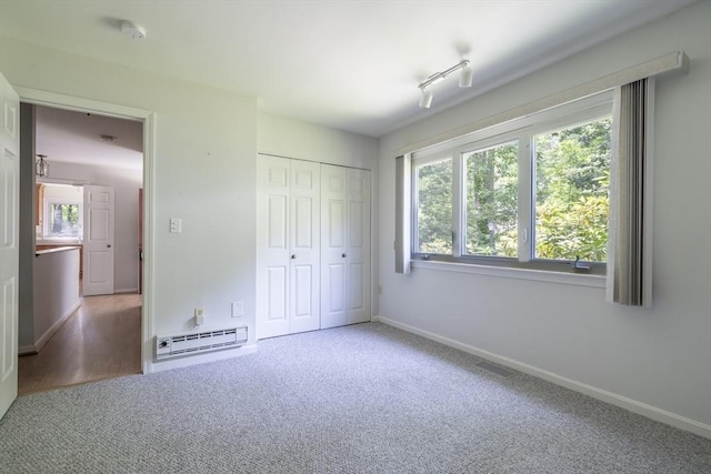87 Fifer Ln Unit 87, Lexington, MA 02421 - unfurnished bedroom with a baseboard radiator, carpet floors, and a closet
