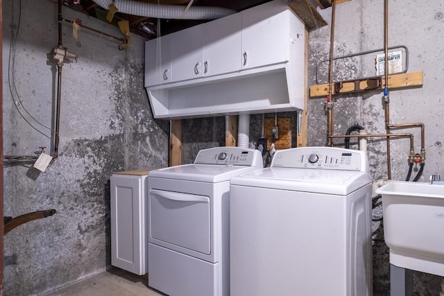 87 Fifer Ln Unit 87, Lexington, MA 02421 - laundry area featuring washing machine and dryer and cabinet space