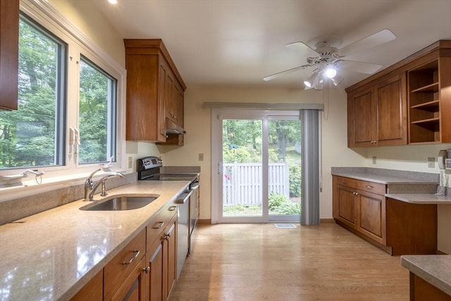 87 Fifer Ln Unit 87, Lexington, MA 02421 - kitchen with stainless steel range with electric stovetop, brown cabinetry, open shelves, and plenty of natural light