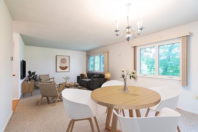 87 Fifer Ln Unit 87, Lexington, MA 02421 - dining room featuring a chandelier and light carpet