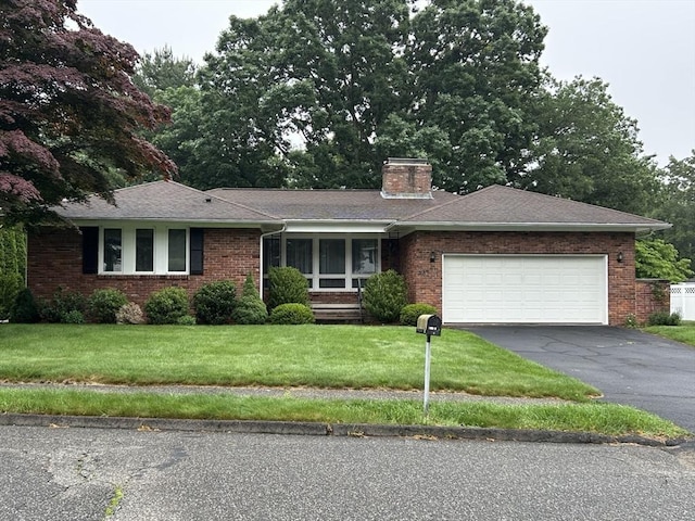 27 Chestnut Hill, South Hadley, MA 01075 - ranch-style house featuring driveway, a front lawn, a chimney, an attached garage, and brick siding
