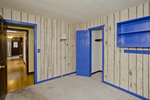 27 Chestnut Hill, South Hadley, MA 01075 - spare room with wooden walls and carpet flooring