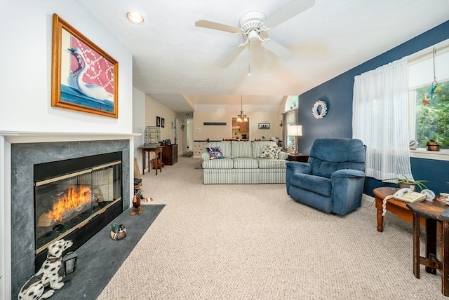 living room with carpet floors and ceiling fan