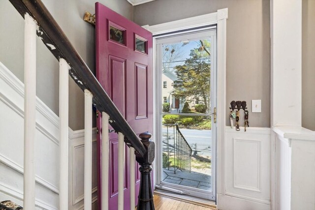entrance foyer featuring light wood-style flooring and stairway