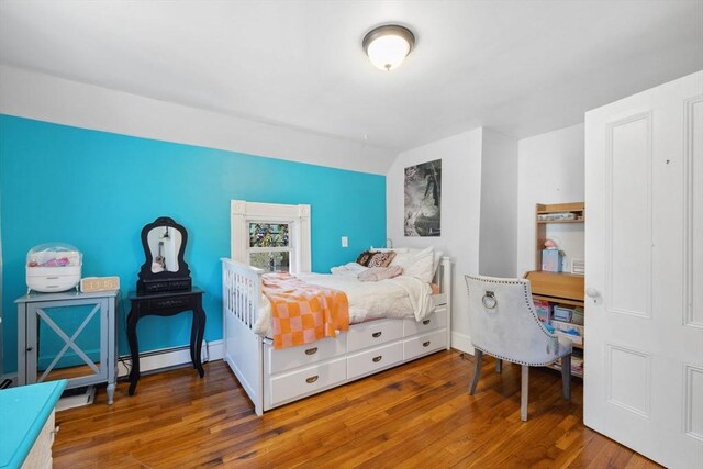 bedroom featuring wood finished floors