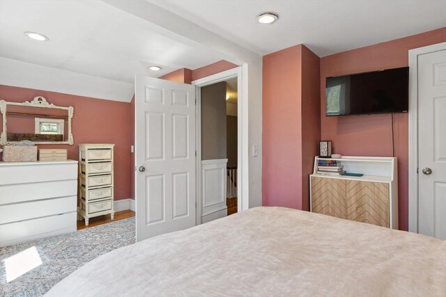 bedroom featuring recessed lighting and wood finished floors
