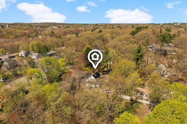 drone / aerial view featuring a view of trees
