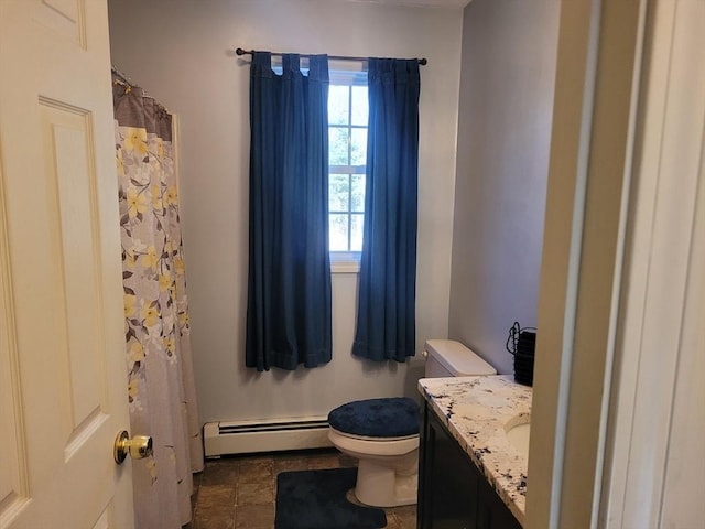 bathroom featuring vanity, toilet, and a baseboard heating unit