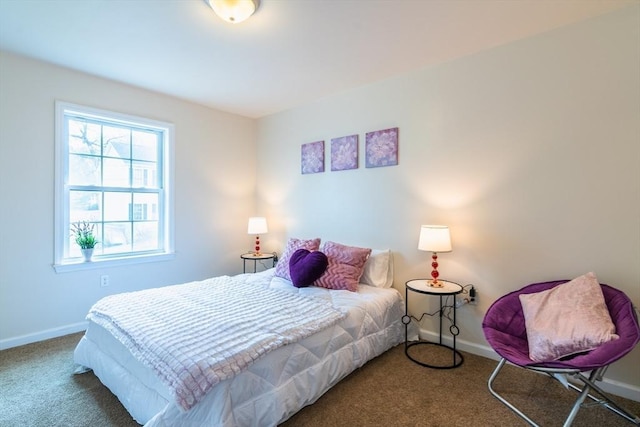 bedroom with baseboards and carpet