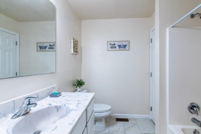 bathroom with toilet, marble finish floor, tub / shower combination, baseboards, and vanity